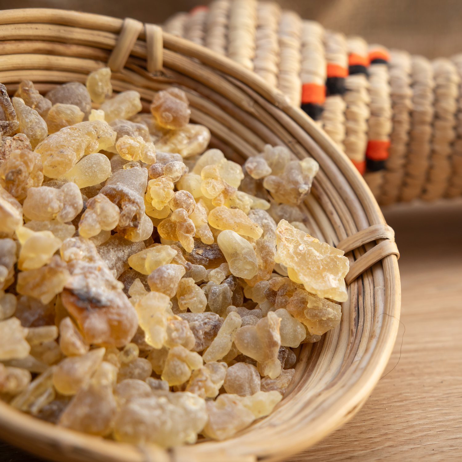 Omani Boswellia Sacra frankincense resin crystals in a woven basket