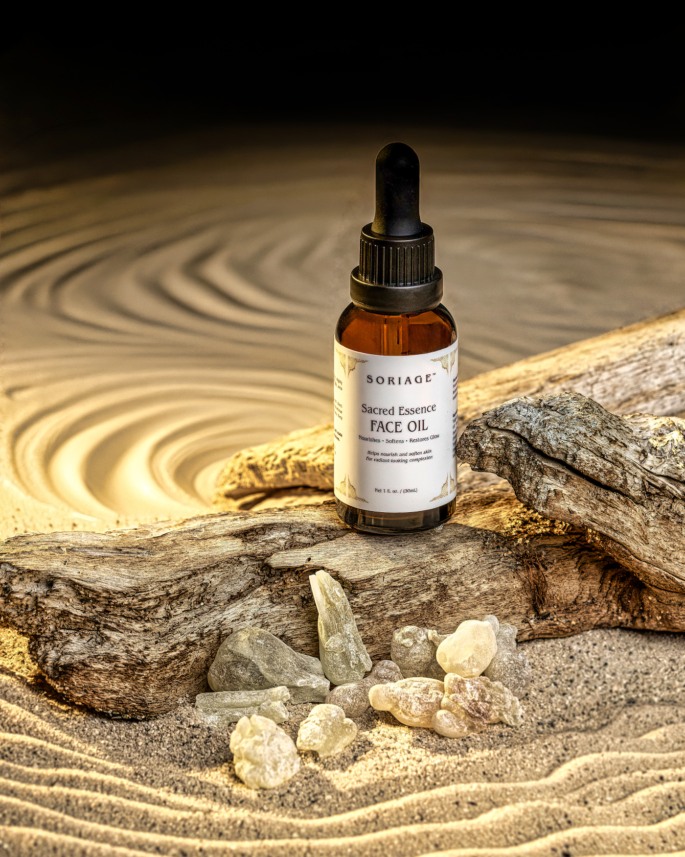 Sacred Essence Face Oil in the sand with Frankincense resin